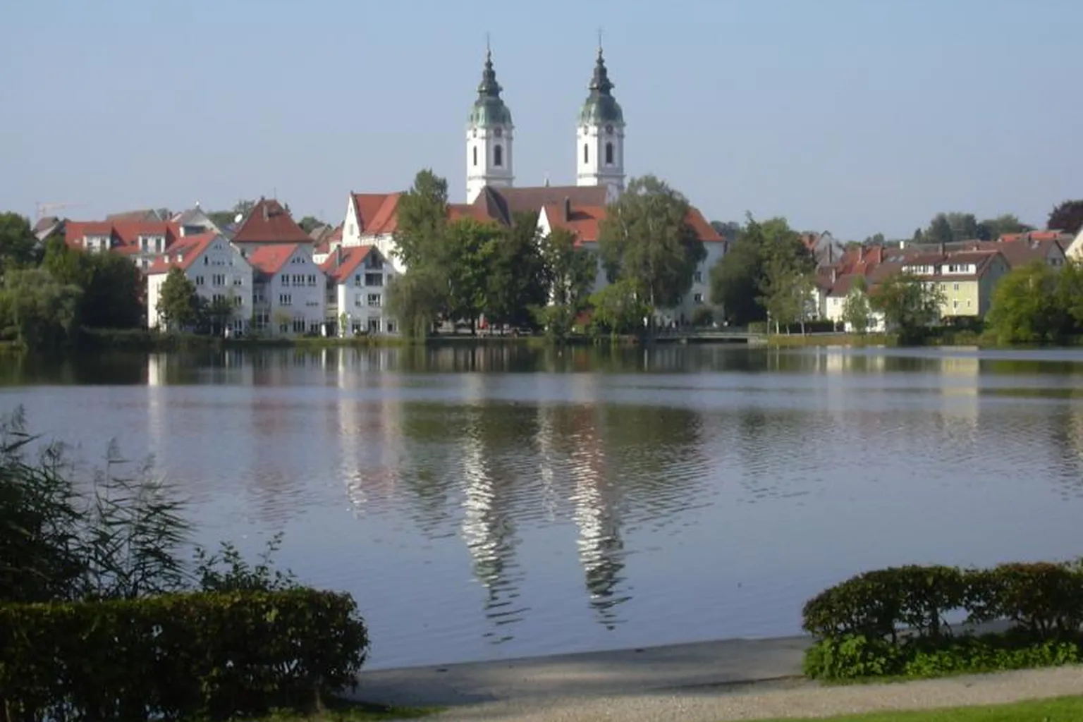 Lake in Bad Waldsee, Germany, with St. Peter's church in the background